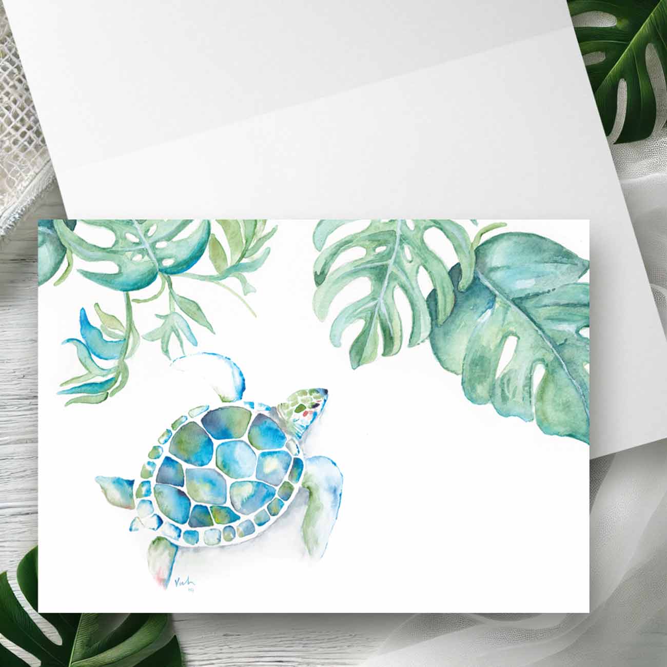 Watercolor sea turtle notecard with monstera palm leaves in turquoise blue and green, folded 4.25 x 5.5 blank card by Do Tell A Belle — tropical beach stationery and thank you card design.