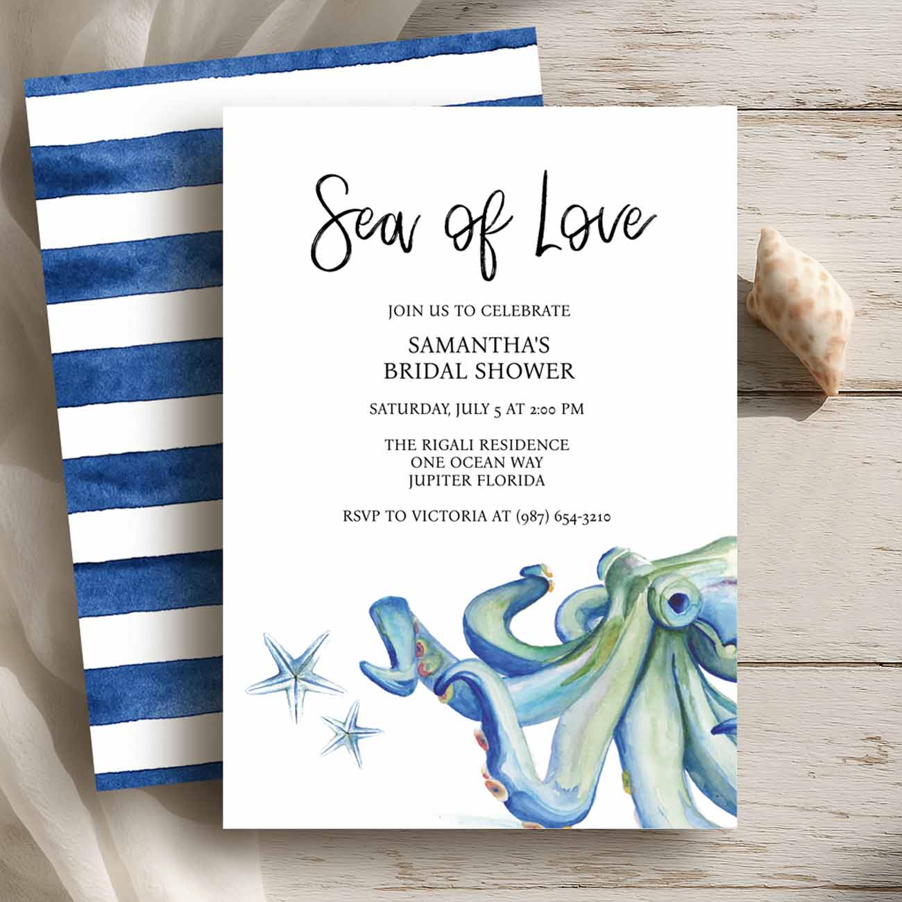Flat lay of nautical bridal shower invitations with watercolor octopus and starfish in shades of blue and navy blue by Victoria Grigaliunas of Do Tell A Belle a small business in Palm Beach Florida