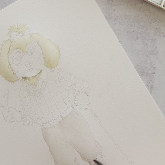 Behind-the-scenes watercolor painting of a Morkie Poo in a Christmas golf outfit holding a peppermint martini for dog Christmas cards.