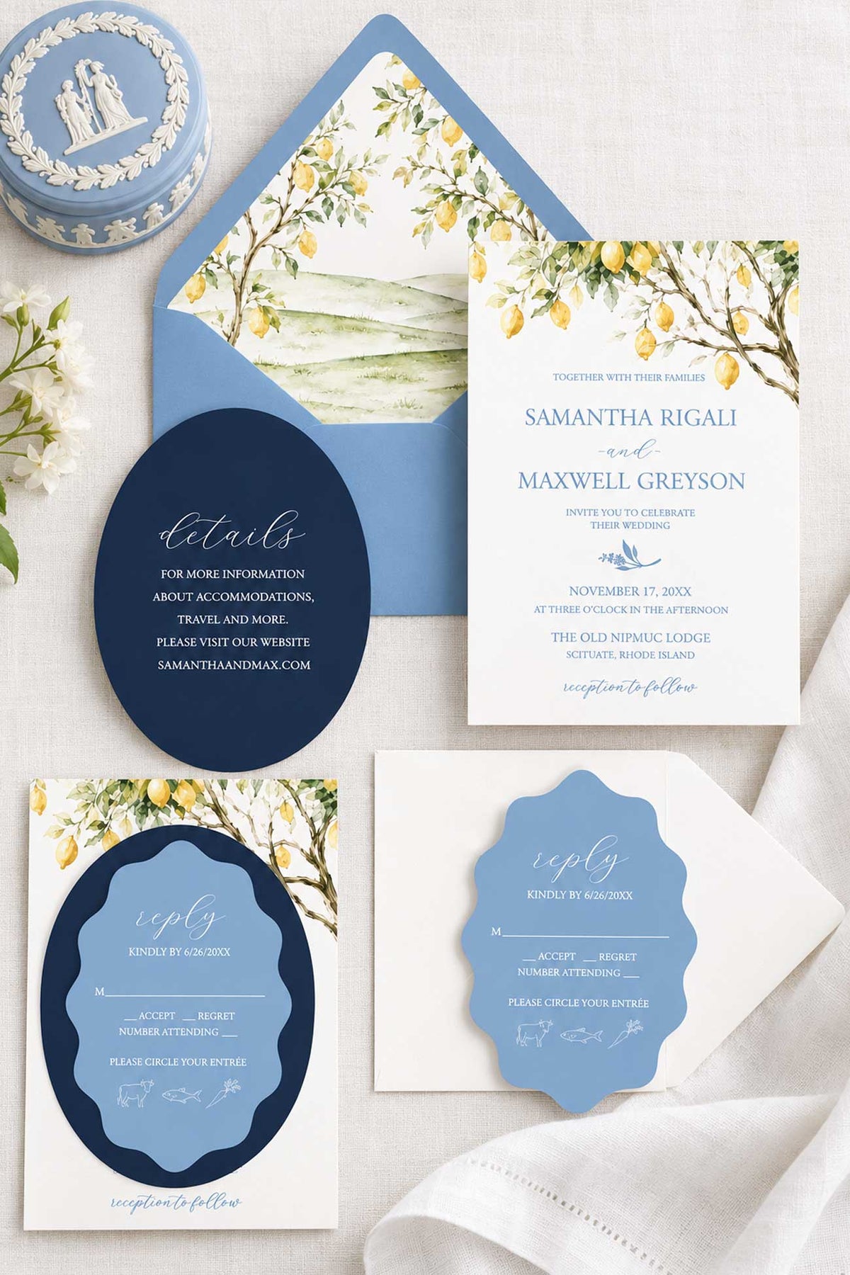 Semi-custom watercolor wedding invitations featuring a blue and yellow Tuscan wedding invitation suite with lemon trees and die cut wedding invitations. Stylized photo include a wedgwood box, botanicals and a white cloth.