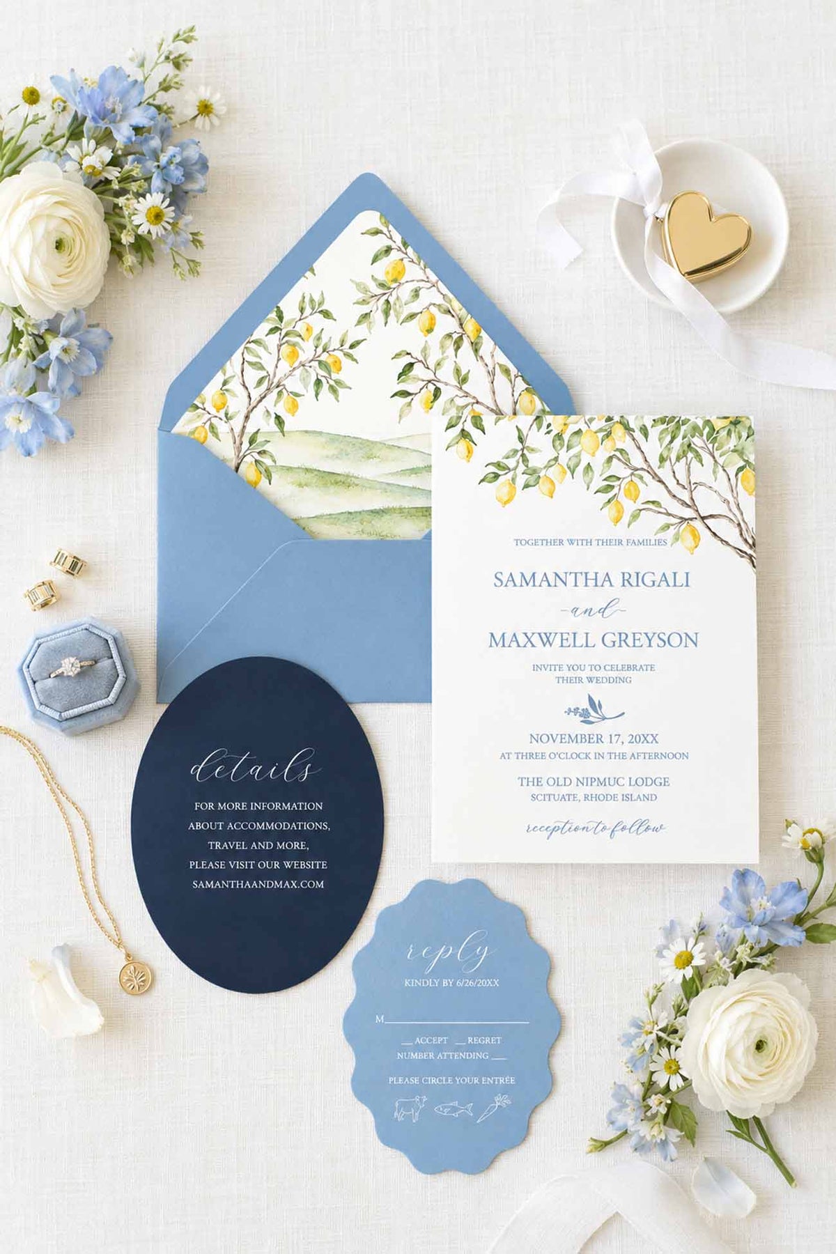 Semi-custom watercolor wedding invitations featuring a blue and yellow Tuscan wedding invitation suite with lemon trees and die cut wedding invitations. Stylized photo include a wedgwood box, botanicals and a white cloth.